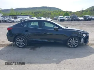 2017 Mazda 3 Touring z VIN 3MZBN1V74HM133565, wystawiony jako IAAI lot #42160836 z przebiegiem 104 997 mil mil oraz . Historia ofert i sprzedaży dostępna na DreamBid. Obrazek 13.