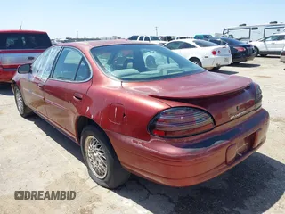 2000 Pontiac Grand Prix SE with VIN 1G2WJ52K3YF262773, listed as a IAAI auction lot 42031719 with 164,284 mi miles. Bid and sale history available at carsss.com. Image 3.