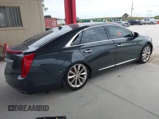 2014 Cadillac XTS Luxury with VIN 2G61M5S33E9217619, listed as a IAAI auction lot 41343003 with 126,303 mi miles. Bid and sale history available at carsss.com. Image 4.