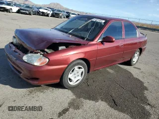 2001 Kia Sephia with VIN KNAFB121015028494, listed as a Copart auction lot 81581404 with 86,655 mi miles and Salvage Title. Bid and sale history available at DreamBid. Image 1.