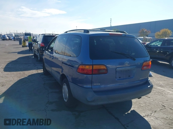 1999 Toyota Sienna LE with VIN 4T3ZF13C2XU126738, listed as a IAAI auction lot 41012127 with 218,080 mi miles. Bid and sale history available at carsss.com. Image 3.