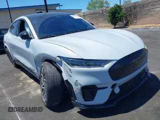 2021 Ford Mustang Mach-E GT z VIN 3FMTK4SX7MME00127, wystawiony jako IAAI lot #42229237 z przebiegiem 19 203 mil mil oraz . Historia ofert i sprzedaży dostępna na DreamBid. Obrazek 1.