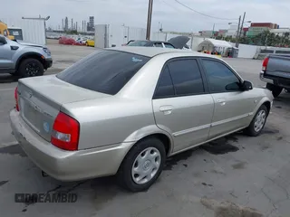 2002 Mazda Protege DX with VIN JM1BJ225121620394, listed as a IAAI auction lot 42043056 with 187,360 mi miles and . Bid and sale history available at DreamBid. Image 4.