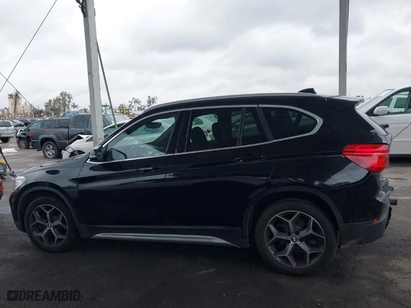 2019 BMW X1 sDrive28i with VIN WBXHU7C54K3H45266, listed as a IAAI auction lot 41572498 with 81,303 mi miles. Bid and sale history available at carsss.com. Image 14.
