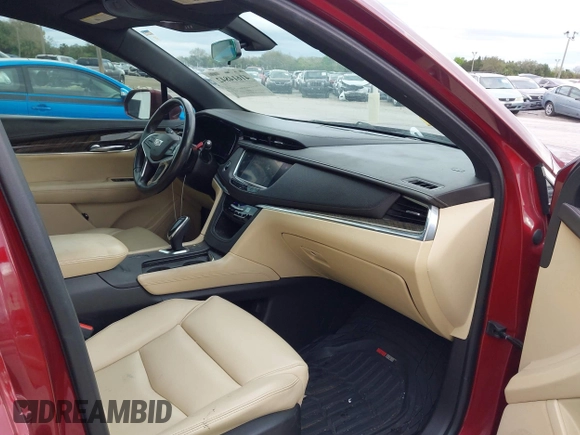 2017 Cadillac XT5 FWD with VIN 1GYKNARS2HZ107587, listed as a IAAI auction lot 41614842 with 124,611 mi miles and . Bid and sale history available at carsss.com. Image 5.