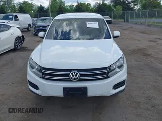 2014 Volkswagen Tiguan S with VIN WVGBV3AX0EW589381, listed as a IAAI auction lot 42186999 with 144,137 mi miles and . Bid and sale history available at DreamBid. Image 12.
