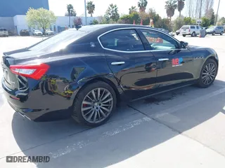 2019 Maserati Ghibli with VIN ZAM57XSA5K1328183, listed as a IAAI auction lot 41970101 with 61,260 mi miles. Bid and sale history available at carsss.com. Image 4.