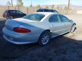 2000 Chrysler LHS with VIN 2C3HC56G0YH390573, listed as a IAAI auction lot 41146903 with 207,371 mi miles. Bid and sale history available at carsss.com. Image 4.