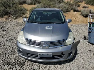 2007 Nissan Versa 1.8 S with VIN 3N1BC11E17L446450, listed as a Copart auction lot 52631415 with 121,006 mi miles and Salvage Title. Bid and sale history available at carsss.com. Image 5.