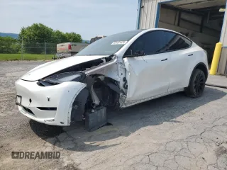 2023 Tesla Model Y Long Range z VIN 7SAYGDEE0PF676165, wystawiony jako Copart lot #59161425 z przebiegiem 50 940 mil mil oraz Szkoda całkowita • Salvage title. Historia ofert i sprzedaży dostępna na DreamBid. Obrazek 1.