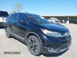 2018 Honda CR-V Touring with VIN 2HKRW2H91JH630702, listed as a IAAI auction lot 41983516 with 84,355 mi miles. Bid and sale history available at carsss.com. Image 1.