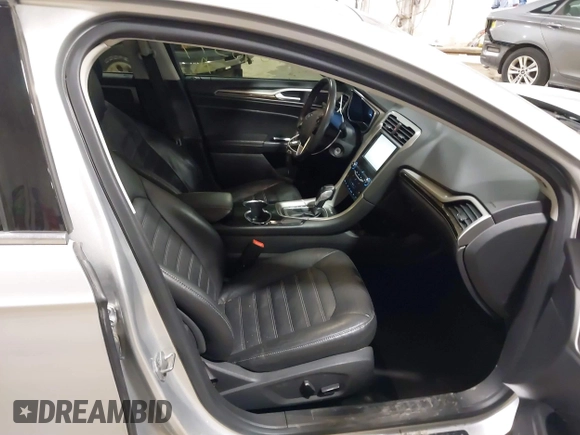 2014 Ford Fusion SE Hybrid with VIN 3FA6P0LU8ER183231, listed as a IAAI auction lot 41848377 with 130,496 mi miles. Bid and sale history available at carsss.com. Image 5.