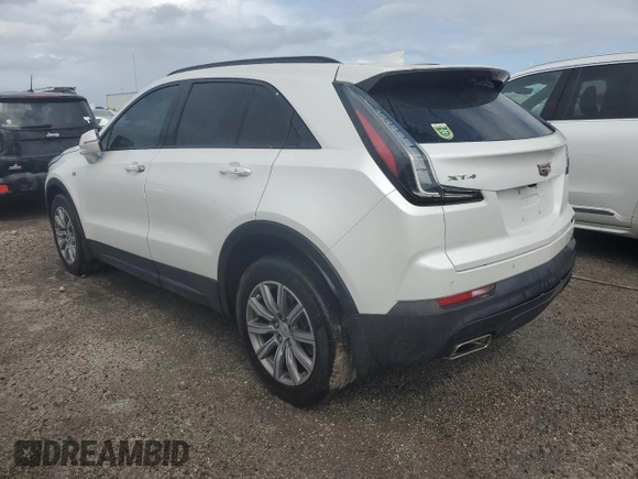2022 Cadillac XT4 FWD Sport z VIN 1GYFZER44NF118862, wystawiony jako Copart lot #55231775 z przebiegiem 14 983 mil mil oraz Nie do naprawy • Non repairable. Historia ofert i sprzedaży dostępna na DreamBid. Obrazek 2.