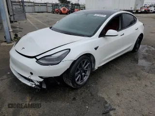 2023 Tesla Model 3 with VIN 5YJ3E1EAXPF574333, listed as a Copart auction lot 60702975 with 28,824 mi miles and Salvage title. Bid and sale history available at DreamBid. Image 1.