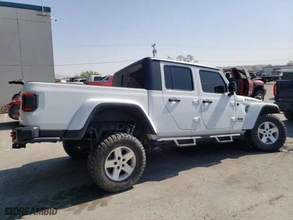 2020 Jeep Gladiator Rubicon with VIN 1C6JJTBG3LL138767, listed as a Copart auction lot 58490974 with 48,542 mi miles and Salvage Title. Bid and sale history available at carsss.com. Image 3.
