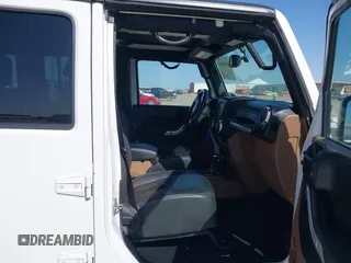 2014 Jeep Wrangler Unlimited Rubicon with VIN 1C4BJWFG1EL167423, listed as a IAAI auction lot 41861109 with 104,669 mi miles. Bid and sale history available at carsss.com. Image 5.