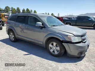 2012 Dodge Journey SXT z VIN 3C4PDDBG0CT345864, wystawiony jako Copart lot #55453875 z przebiegiem 142 444 mil mil oraz Szkoda całkowita • Salvage title. Historia ofert i sprzedaży dostępna na DreamBid. Obrazek 4.