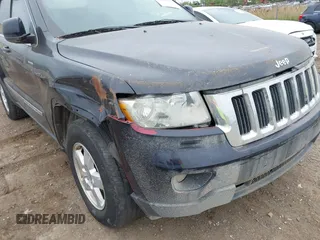 2011 Jeep Grand Cherokee Laredo with VIN 1J4RR4GG9BC608778, listed as a IAAI auction lot 42314313 with 151,780 mi miles and . Bid and sale history available at DreamBid. Image 13.