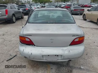 1998 Hyundai Elantra with VIN KMHJF24M7WU672436, listed as a IAAI auction lot 41763627 with 114,288 mi miles and . Bid and sale history available at DreamBid. Image 17.