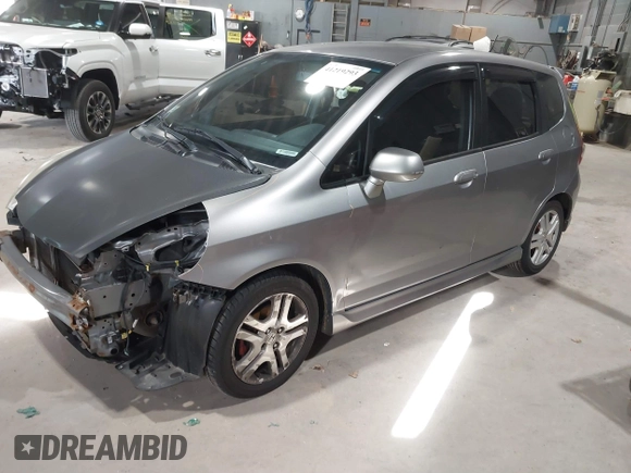 2007 Honda Fit Sport with VIN JHMGD37637S052380, listed as a IAAI auction lot 41219293 with 171,586 mi miles. Bid and sale history available at carsss.com. Image 2.