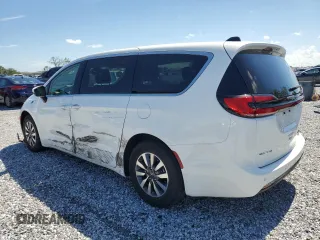 2023 Chrysler Pacifica Hybrid Touring L z VIN 2C4RC1L74PR558768, wystawiony jako Copart lot #61407555 z przebiegiem 70 387 mil mil oraz Czysty tytuł • Clean title. Historia ofert i sprzedaży dostępna na DreamBid. Obrazek 2.