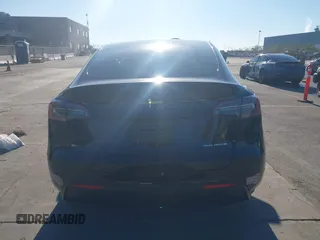 2024 Tesla Model Y Long Range with VIN 7SAYGAEE7RF014424, listed as a IAAI auction lot 41402098 with 6,052 mi miles and . Bid and sale history available at DreamBid. Image 16.
