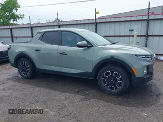 2022 Hyundai Santa Cruz SEL with VIN 5NTJB4AEXNH034989, listed as a IAAI auction lot 42176050 with 27,297 mi miles and . Bid and sale history available at DreamBid. Image 14.
