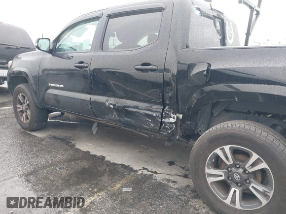 2017 Toyota Tacoma SR5 with VIN 5TFAZ5CN0HX053573, listed as a IAAI auction lot 41797867 with 102,628 mi miles and . Bid and sale history available at DreamBid. Image 6.