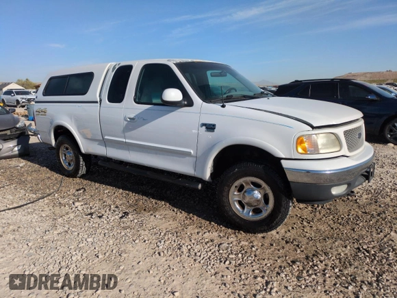 1999 Ford F-150 XL with VIN 1FTRX18L2XKA97143, listed as a Copart auction lot 52973695 with 115,180 mi miles and Salvage Title. Bid and sale history available at carsss.com. Image 4.