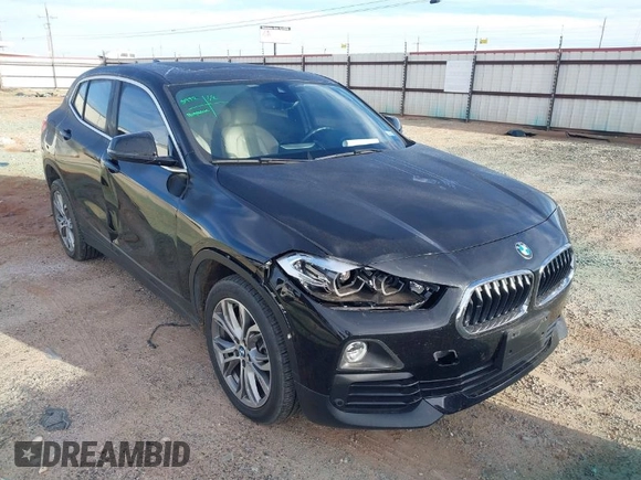 2020 BMW X2 xDrive28i with VIN WBXYJ1C02L5P31038, listed as a IAAI auction lot 41338219 with 72,854 mi miles. Bid and sale history available at carsss.com. Image 1.