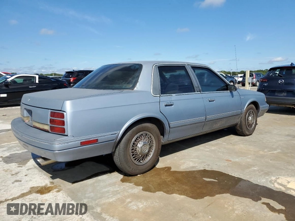 1996 Oldsmobile Cutlass Ciera 1SA VX5 z VIN 1G3AJ55M3T6326130, wystawiony jako Copart lot #73877264 z przebiegiem 74 073 mil mil oraz Szkody całkowita. Historia ofert i sprzedaży dostępna na DreamBid. Obrazek 3.