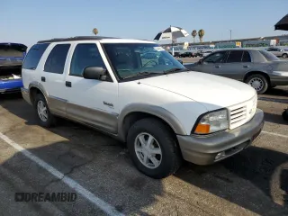 2000 Oldsmobile Bravada z VIN 1GHDT13W7Y2351268, wystawiony jako Copart lot #66408824 z przebiegiem 134 512 mil mil oraz Tytuł czysty. Historia ofert i sprzedaży dostępna na DreamBid. Obrazek 4.