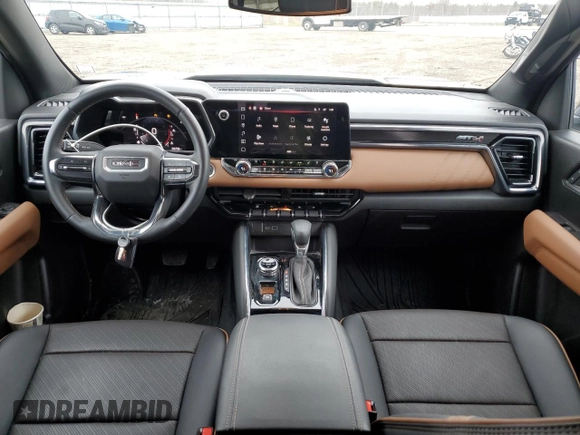 2023 GMC Canyon 4WD AT4 with VIN 1GTP6DEK5P1170230, listed as a Copart auction lot 52767295 with 26,769 mi miles and Salvage Title. Bid and sale history available at carsss.com. Image 8.
