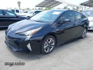 2017 Toyota Prius Two with VIN JTDKARFUXH3041668, listed as a IAAI auction lot 42421754 with 57,677 mi miles and . Bid and sale history available at DreamBid. Image 2.