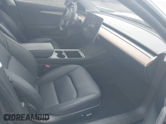 2023 Tesla Model 3 with VIN 5YJ3E1EAXPF693693, listed as a IAAI auction lot 41709704 with 12,473 mi miles and . Bid and sale history available at DreamBid. Image 5.