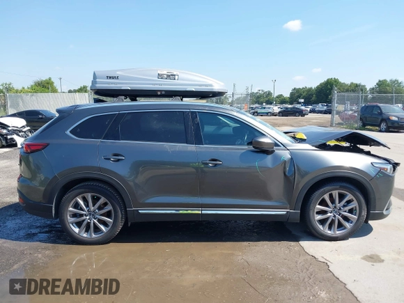 2022 Mazda CX-9 Grand Touring with VIN JM3TCBDY4N0618680, listed as a IAAI auction lot 40086806 with 34,142 mi miles and . Bid and sale history available at DreamBid. Image 13.