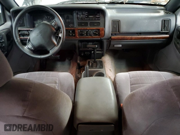 1996 Jeep Grand Cherokee Laredo with VIN 1J4GZ58S0TC402024, listed as a Copart auction lot 65074774 with 163,477 mi miles and Salvage Title. Bid and sale history available at carsss.com. Image 8.