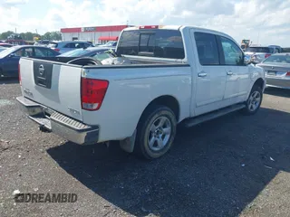 2004 Nissan Titan LE with VIN 1N6AA07A04N561241, listed as a IAAI auction lot 42180597 with 166,529 mi miles and . Bid and sale history available at DreamBid. Image 4.