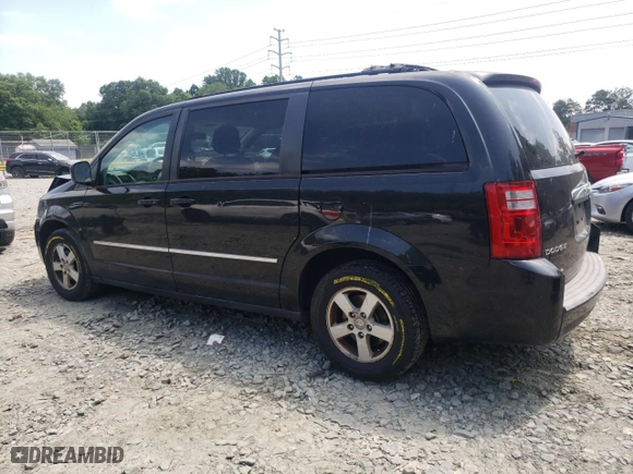 2010 Dodge Grand Caravan SXT with VIN 2D4RN5D12AR444791, listed as a Copart auction lot 77529904 with 149,676 mi miles and Salvage Title. Bid and sale history available at carsss.com. Image 2.