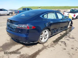 2014 Tesla Model S 60 with VIN 5YJSA1H11EFP47897, listed as a IAAI auction lot 41802285 with Not Provided miles and . Bid and sale history available at DreamBid. Image 4.