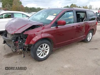 2019 Dodge Grand Caravan SXT with VIN 2C4RDGCGXKR585563, listed as a IAAI auction lot 40949350 with 122,577 mi miles and . Bid and sale history available at DreamBid. Image 2.