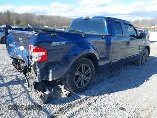 2007 Ford F-150 STX with VIN 1FTRX02W57KD56589, listed as a IAAI auction lot 41189911 with 140,093 mi miles. Bid and sale history available at carsss.com. Image 4.