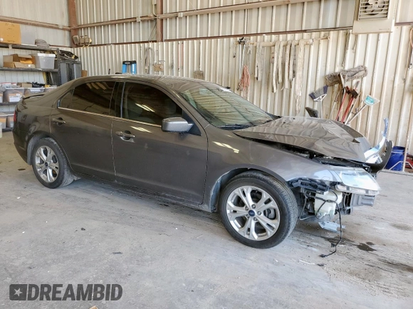 2012 Ford Fusion SE z VIN 3FAHP0HA1CR320160, wystawiony jako Copart lot #57597615 z przebiegiem 142 938 mil mil oraz Szkoda całkowita • Salvage title. Historia ofert i sprzedaży dostępna na DreamBid. Obrazek 4.
