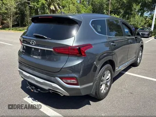 2019 Hyundai Santa Fe SE with VIN 5NMS23AD6KH135184, listed as a Copart auction lot 55706565 with 196,819 mi miles and Clean Title. Bid and sale history available at carsss.com. Image 4.