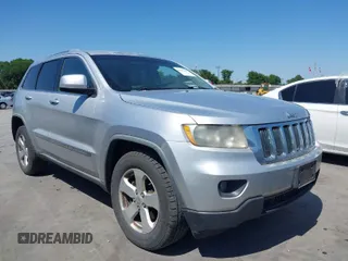 2012 Jeep Grand Cherokee Laredo with VIN 1C4RJEAG5CC112230, listed as a IAAI auction lot 41997483 with 302,923 mi miles. Bid and sale history available at carsss.com. Image 1.