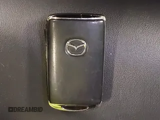 2021 Mazda CX-30 Preferred z VIN 3MVDMBCL2MM210902, wystawiony jako IAAI lot #42522203 z przebiegiem 42 995 mil mil oraz . Historia ofert i sprzedaży dostępna na DreamBid. Obrazek 11.