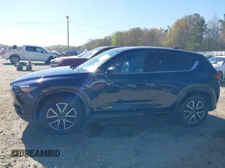 2018 Mazda CX-5 Grand Touring with VIN JM3KFADM1J0322049, listed as a IAAI auction lot 41891079 with 174,939 mi miles and . Bid and sale history available at DreamBid. Image 14.