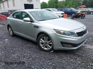 2011 Kia Optima EX z VIN KNAGN4A71B5148051, wystawiony jako IAAI lot #42536619 z przebiegiem 98 959 mil mil oraz . Historia ofert i sprzedaży dostępna na DreamBid. Obrazek 1.