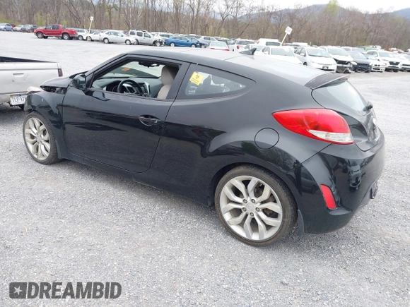 2012 Hyundai Veloster w/Gray Int z VIN KMHTC6AD6CU054422, wystawiony jako IAAI lot #41930634 z przebiegiem 144 681 mil mil oraz . Historia ofert i sprzedaży dostępna na DreamBid. Obrazek 3.