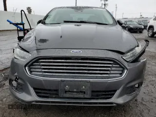 2016 Ford Fusion Titanium Hybrid z VIN 3FA6P0RU5GR356987, wystawiony jako Copart lot #48211775 z przebiegiem 145 192 mil mil oraz Szkoda całkowita • Salvage title. Historia ofert i sprzedaży dostępna na DreamBid. Obrazek 5.